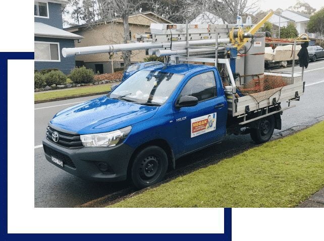 Home » Hot water system A blue Toyota Hilux service truck for Hogan Hot Water parked on a residential street