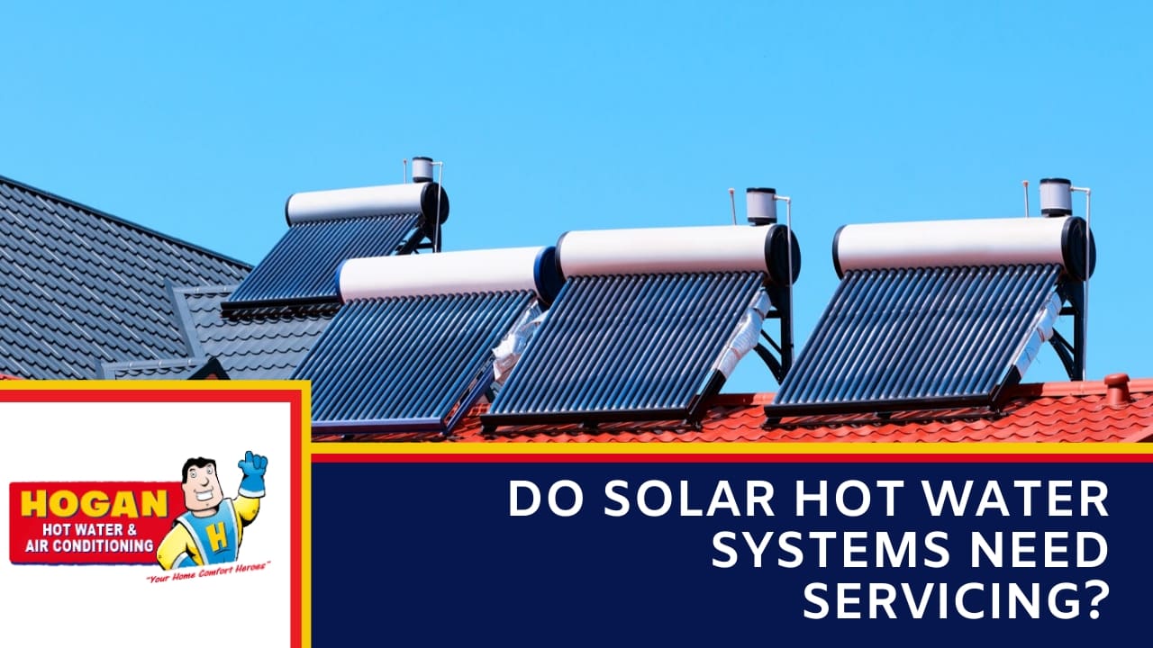 An evacuated tube solar collector panels with horizontal storage tanks installed on a residential roof