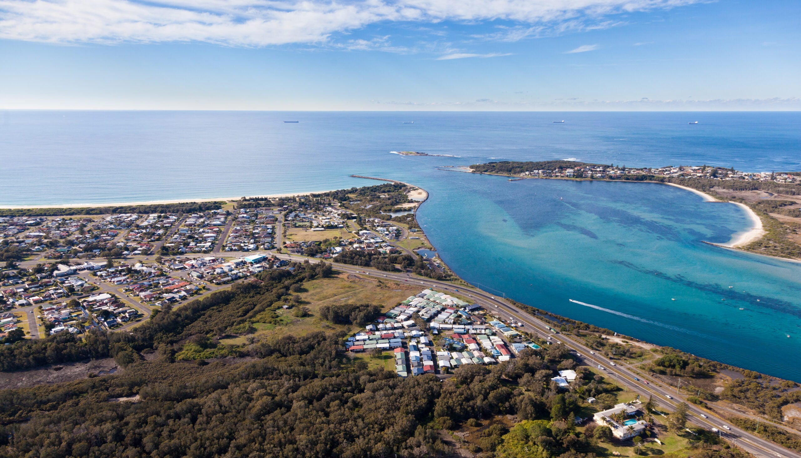 Aerial view of Blacksmiths Beach and Swansea Channel at the mouth of Lake Macquarie - Australia's largest salt water lake