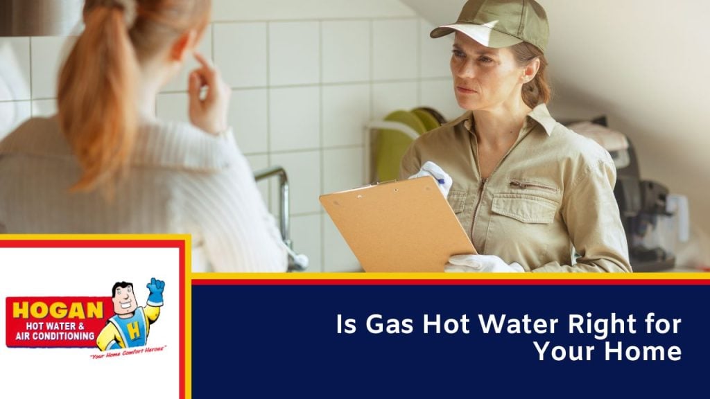 A technician in a cap and uniform holding a clipboard while speaking with a homeowner in a kitchen.
