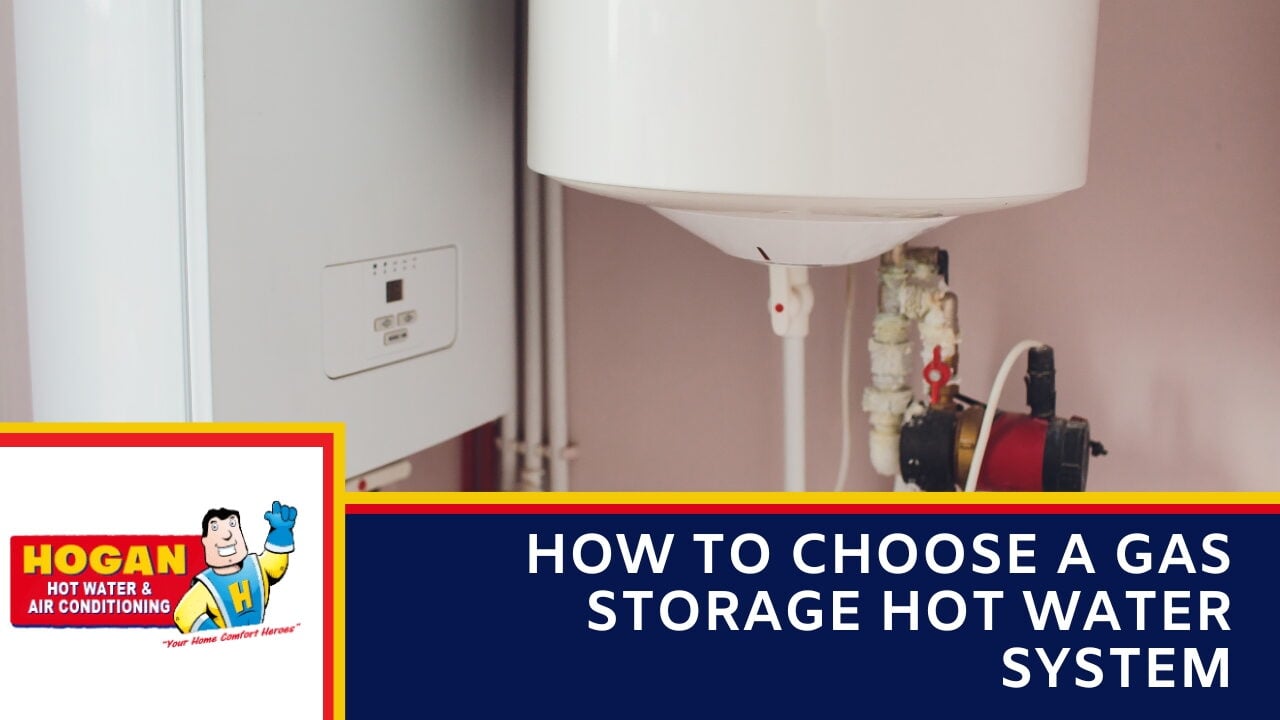 A white wall-mounted boiler and tank with exposed plumbing and a red circulation pump.