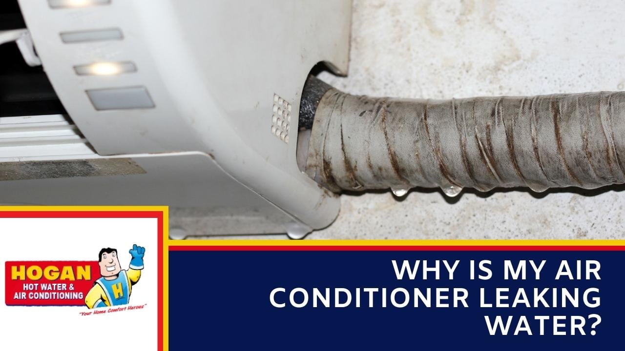 A white indoor air conditioning unit with water droplets dripping from the insulated drainage pipe.