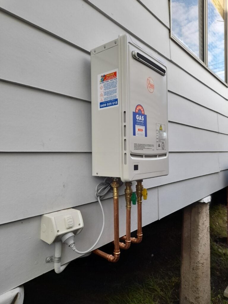 Rheem Metro 26 continuous flow natural gas hot water system installed on the exterior wall of a home in Newcastle, NSW