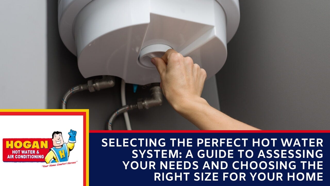 A hand adjusting the control knob on the underside of a white electric hot water unit.
