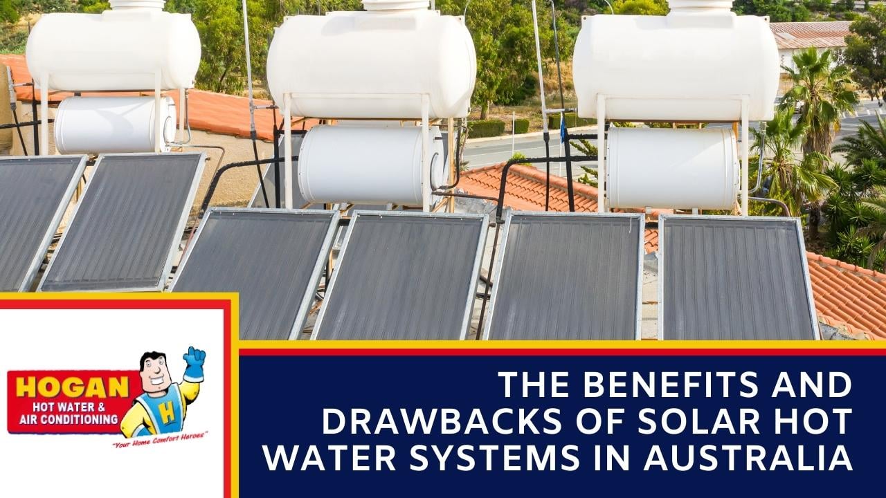 A three sets of solar panels and storage tanks installed on a rooftop