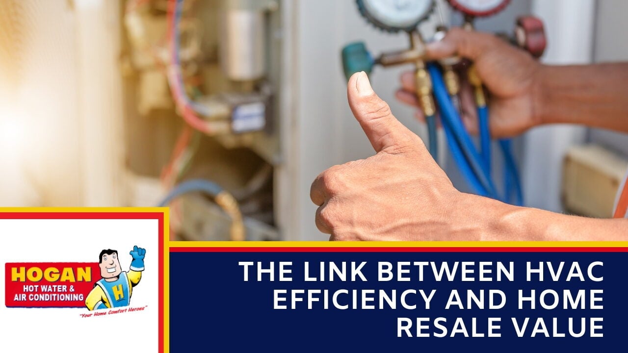 A technician giving a thumbs-up in the foreground while holding pressure gauges connected to an HVAC system.