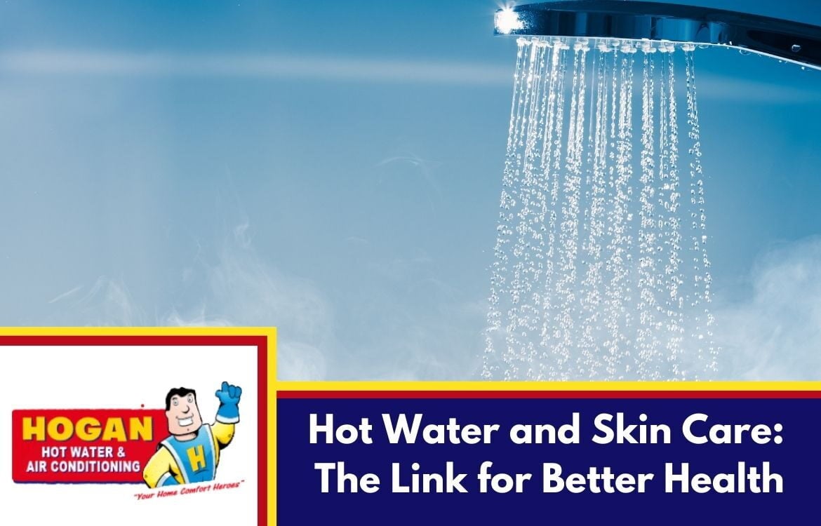 A modern chrome showerhead with water running against a steamy blue background.