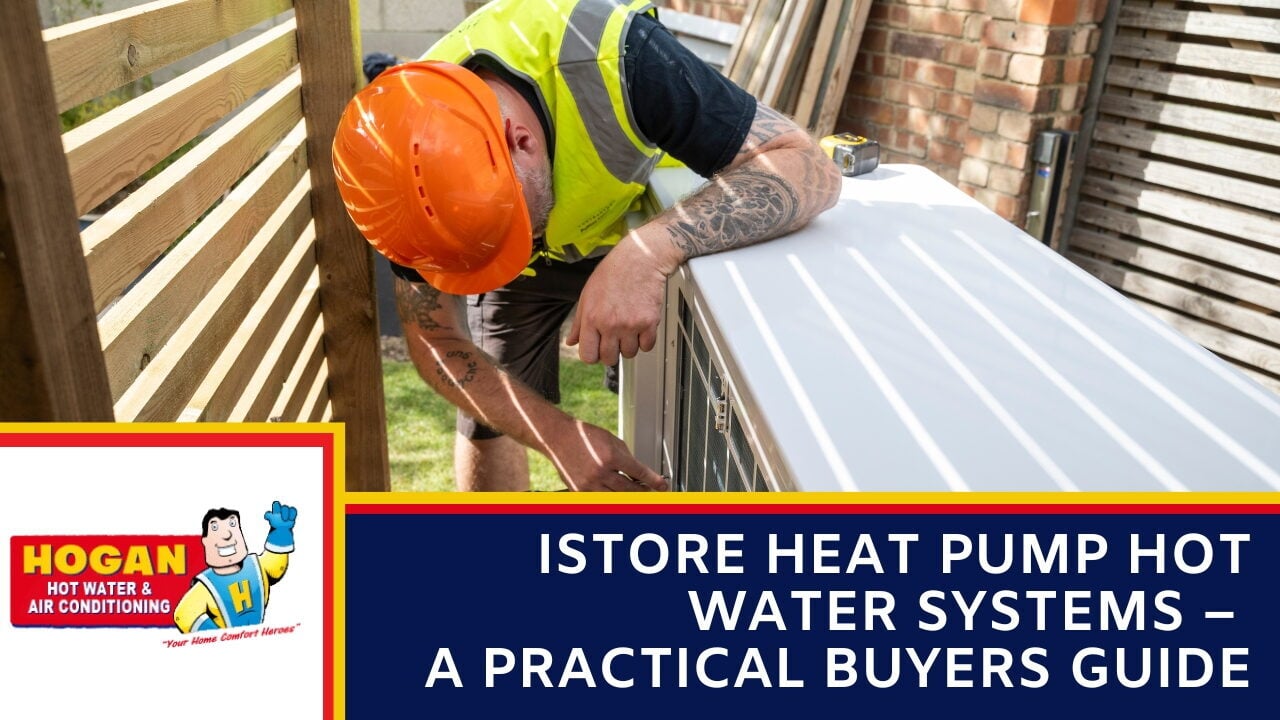 An HVAC worker in an orange hard hat and safety vest installing an outdoor heat pump system in a backyard.