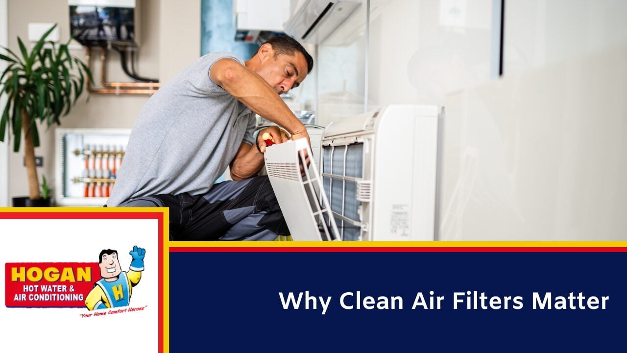 A technician is repairing or installing an air conditioning unit inside a modern room.