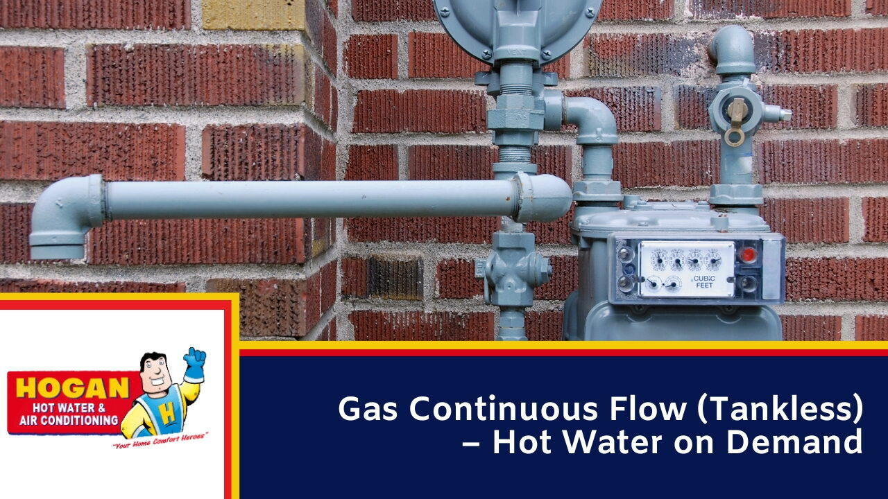Tankless hot water system components and gas meter installed on a brick wall for efficient water heating.