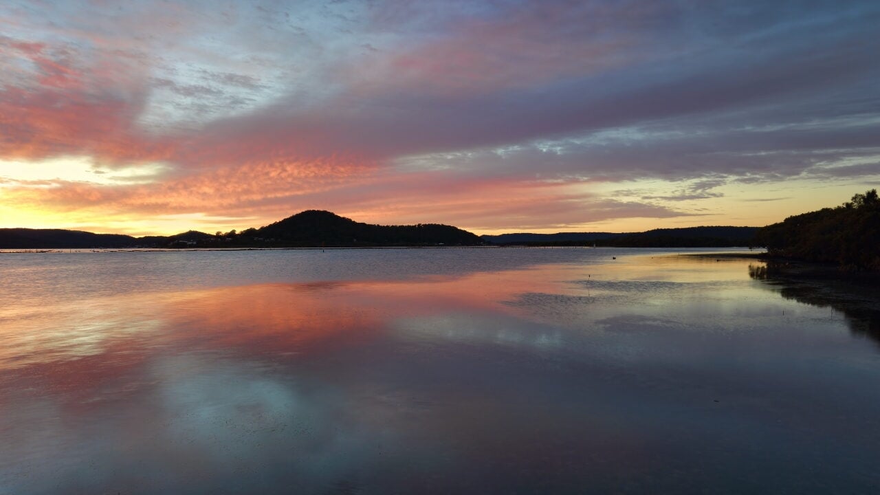 A wide landscape view of a calm body of water in Koowelong