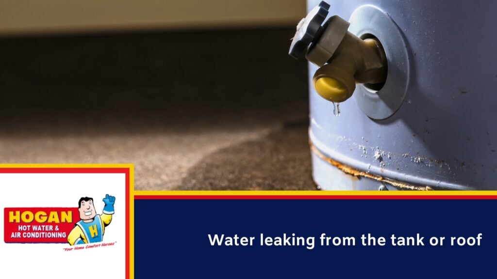 A water heater drain valve dripping water onto a wet floor.