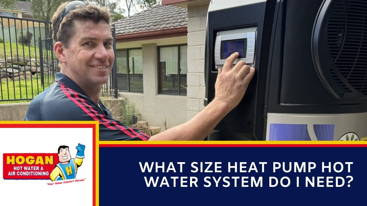 Technician adjusting a heat pump hot water system display panel outside a house