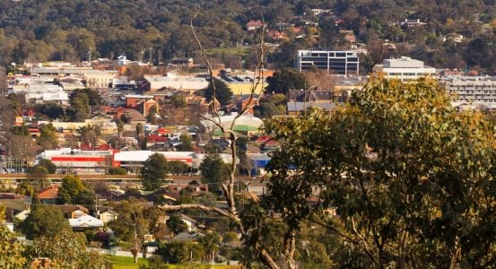 Hot Water Installation and Maintenance Hamilton An elevated view of a suburban town nestled in a valley,